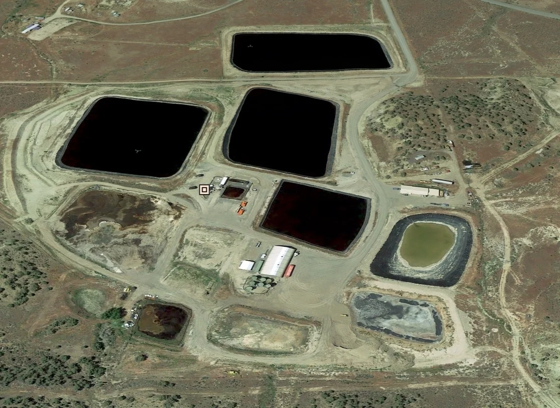 Aerial view of the Greenleaf Mesa Facility showing the evaporation ponds, solids impoundments, and injection well site